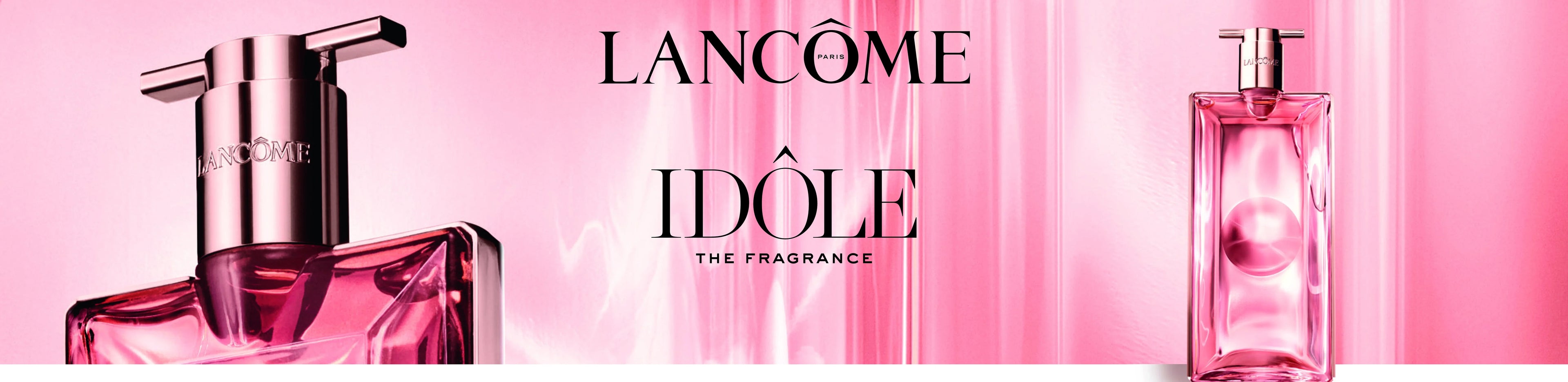 Lancôme Idôle perfume bottle in rose gold on a pink background, luxury fragrance visual