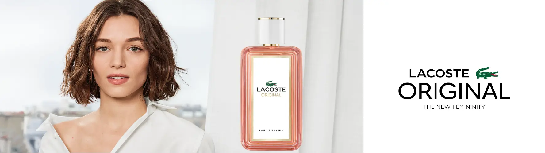 Lacoste Original perfume bottle on table with white curtain and city view background