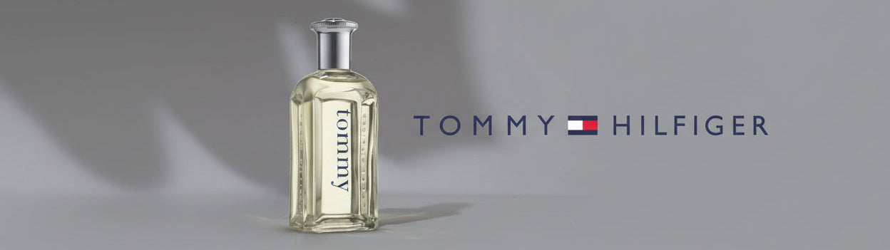 Clear Tommy Hilfiger perfume bottle and logo on a grey background, luxury fragrance