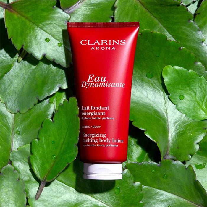 EAU DYNAMISANTE ENERGIZING MELTING BODY LOTION - FRAGRANCED + MOISTURIZING BODY LOTION by CLARINS at Sundora
